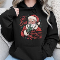Humorous Bookworm Santa Hooded Sweatshirt, He Sees What You've Been Reading Hoodie, Christmas Book Lover Hoodie, Holiday Reader Graphic Sweater