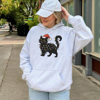 Festive Kitty Fairy Lights Hooded Sweatshirt, Black Cat Christmas Hoodie, Comfy Cat Lover Christmas Hoodie, Adorable Holiday Animal Pullover