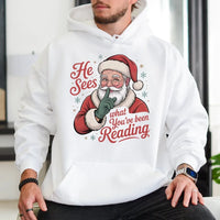 Humorous Bookworm Santa Hooded Sweatshirt, He Sees What You've Been Reading Hoodie, Christmas Book Lover Hoodie, Holiday Reader Graphic Sweater