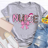 Nurse Christmas Shirt, School Nurse Santa Hat Pink Bow Shirt, Festive Holiday Medical Tee, Adorable Coquette Nurse Graphic Shirt