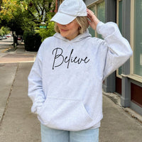 Minimalist Cursive Holiday Script Sweatshirt, Believe Christmas Hoodie, Winter Festive Polar Express Pullover, Comfy Xmas Hooded Apparel