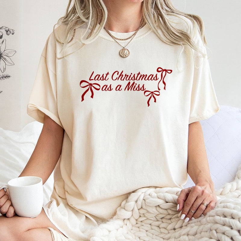 Festive Bow Typography Bride Tee, Last Christmas as A Miss T-Shirt, Holiday Engagement Graphic Shirt, Winter Bachelorette Present for Her