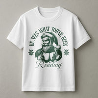 Humorous Santa Book Lover T-Shirt, He Sees What You've Been Reading T-Shirt, Bookish Christmas Shirt, Holiday Reader Graphic Tee, Bookworm Present