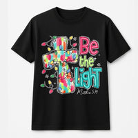 Christmas Cross T-Shirt, Be the Light Christian Shirt, Faith Inspired Holiday Tee, Bible Verse Graphic Shirt, Xmas Present for Women and Men