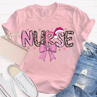 Nurse Christmas Shirt, School Nurse Santa Hat Pink Bow Shirt, Festive Holiday Medical Tee, Adorable Coquette Nurse Graphic Shirt